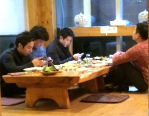 Upon sitting at this banquet table, every man began to use his cellphone.
