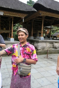 Ketuk Singer, in traditional Balinese dress, explaining the behind the Holy Water Temple, Pura Tirta Empul. "Singer" is enthusiastic about his culture ad religion and was a wonderful teacher in communicating the basic precepts of Tirta.